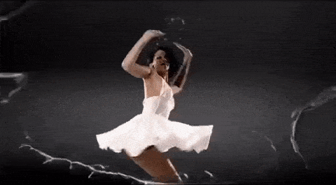 Rihanna splashing water around in a music video