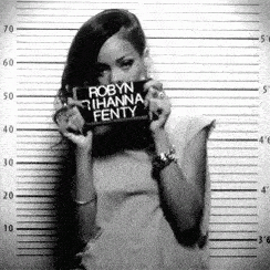 Rihanna with a prison sign